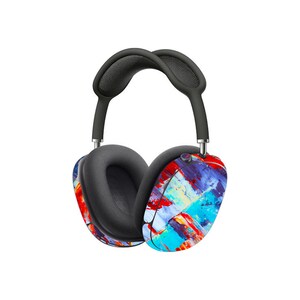 May include: A pair of black wireless headphones with a colourful abstract paint design. The headphones have a black headband and earcups with a colourful abstract paint design.