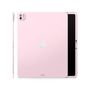 Könnte beinhalten: Ein rosa iPad mit einem weißen Apple-Logo und einem schwarzen Bildschirm. Das iPad befindet sich in einer Schutzhülle.