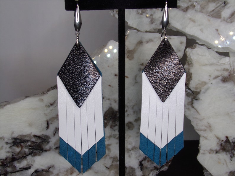 Geometric turquoise fringe earrings with black and silver accents.