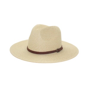 May include: A beige straw hat with a brown leather band and buckle.