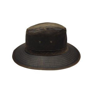 May include: A dark brown leather hat with a wide brim and a slightly distressed appearance. The hat features a rounded crown with two small eyelets and a band around the base of the crown. The brim has a textured, ridged design.