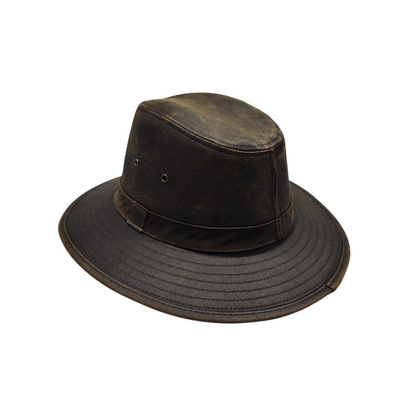 May include: A dark brown leather hat with a wide brim and a band around the crown. The hat has a distressed, weathered appearance, suggesting it's been worn. The hat's design is reminiscent of a safari or outdoor style.