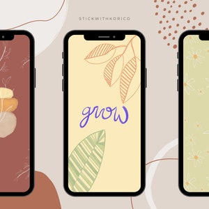 May include: Three smartphones displaying unique abstract wallpapers. One features stacked shapes and a plant, another has the word "grow" with leaf illustrations, and the last showcases a floral pattern. The background is a neutral beige.