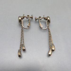 Gold and silver tone metal screw back dangle earrings for the 1960s