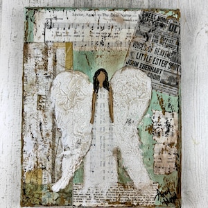 May include: Mixed media artwork featuring a white angel with textured wings and a dress, set against a backdrop of vintage sheet music and newspaper clippings. The artwork has a distressed, aged appearance with a teal and brown color palette. The text "Savior, Again to Thy Dear Name" is visible.