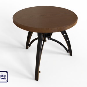 May include: A round wooden table with a dark brown top and a black metal base. The base has a unique design with curved legs and metal accents.