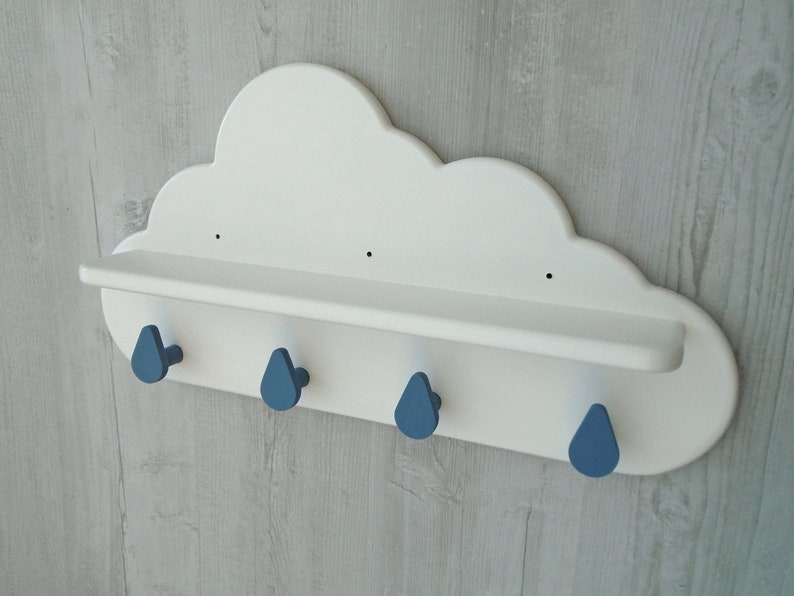 May include: White cloud shaped shelf with four blue raindrop shaped hooks.