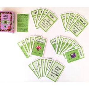 May include: A set of "Story Telling Cards" with a purple box and green and white cards. The cards feature illustrations and prompts like "Green," "A magic toadstool," and "Scared." The box reads "Story Telling Cards."