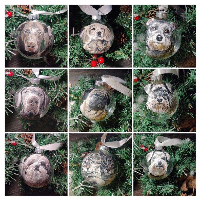 A grid of 9 custom painted pet glass ornaments. Hand painted detailed realistic pet portrait on transparent round glass bauble ornaments. 8 dogs and 1 cat shown.