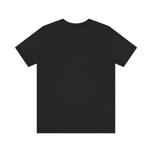 May include: A black short-sleeved t-shirt.