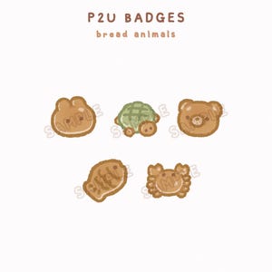 May include: A collection of five cartoon bread animal badges. The badges include a bunny, turtle, bear, fish, and crab. The text "P2U BADGES bread animals" is displayed above the badges. The image also includes the text "REPRODUCTION IS PROHIBITED".