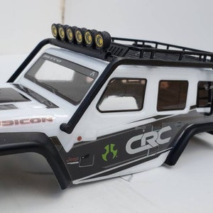 Axial scx24 jeep body armor and roof rack with KC light bar and side ladder