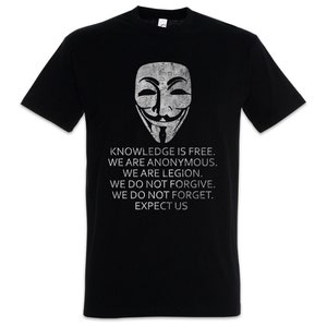 Peut inclure: T-shirt noir avec un graphique blanc du masque d'Anonymous et le texte "KNOWLEDGE IS FREE. WE ARE ANONYMOUS. WE ARE LEGION. WE DO NOT FORGIVE. WE DO NOT FORGET. EXPECT US."