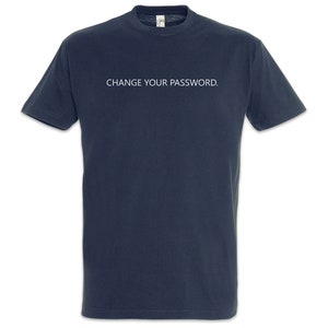 May include: Navy blue t-shirt with the text "CHANGE YOUR PASSWORD." in white. The shirt is a short-sleeved crew neck style, suitable for casual wear. The text is centered on the chest.