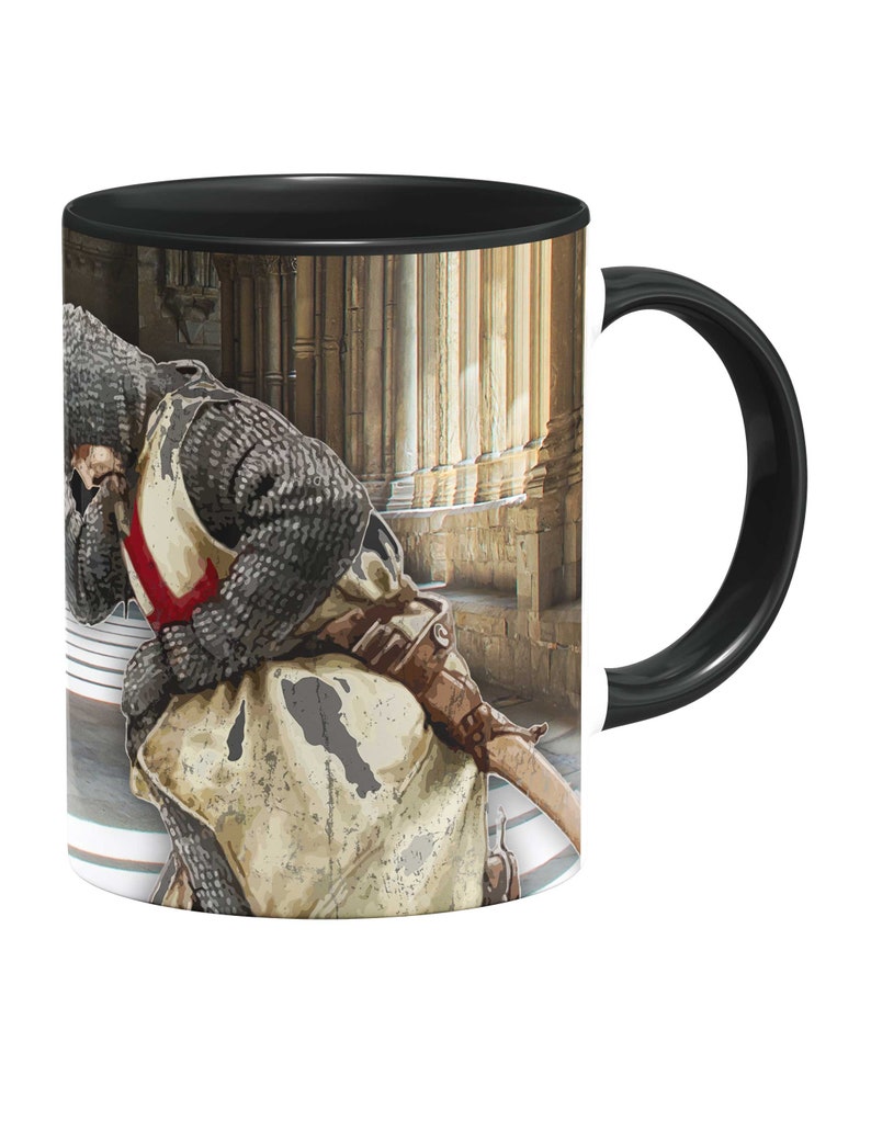 May include: A black and white mug with a graphic of a knight in armor with a red cross on his chest. The knight is standing in a stone hallway with columns.