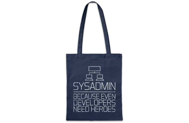 May include: Navy blue tote bag with white text and a computer network graphic. The text reads "SYSADMIN BECAUSE EVEN DEVELOPERS NEED HEROES". The bag has two navy blue handles.