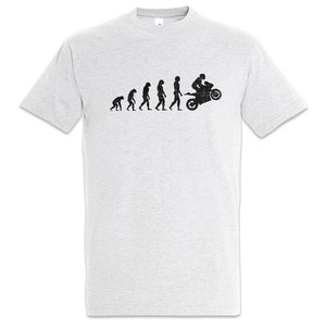 Könnte beinhalten: Hellgraues T-Shirt mit einer schwarzen Grafik, die die menschliche Evolution darstellt und mit einer Person auf einem Motorrad endet. Das Design zeigt die Entwicklung vom Affen zum Biker. Ein lässiges T-Shirt für Motorradfans.