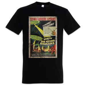 May include: Black t-shirt with a retro movie poster design. The poster says "Flying Saucers Attack!" with images of UFOs attacking Earth. The shirt's design includes the text "Earth vs. The Flying Saucers."
