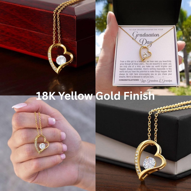 Peut inclure: Un collier pendentif en forme de c&oelig;ur dor&eacute; avec une pierre centrale en cristal transparent. Le collier est pr&eacute;sent&eacute; dans un coffret cadeau avec un message pour une petite-fille pour son jour de remise de dipl&ocirc;me. Le texte "18K Yellow Gold Finish" est &eacute;galement visible.
