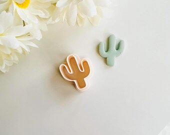 Peut inclure: Deux emportes-pièces en forme de cactus, l'un de couleur rose clair et l'autre de couleur vert clair.