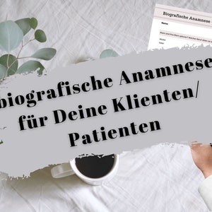 May include: A gray background with the text "biografische Anamnese für Deine Klienten/Patienten" in black bold font. The text is partially obscured by a white cup of coffee and a hand holding a pen.