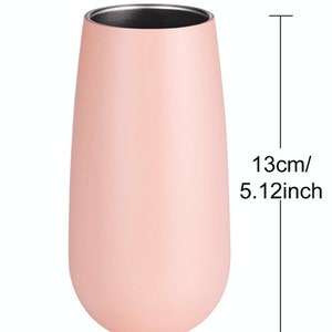 May include: A pink stainless steel tumbler with a silver lid. The tumbler is 5.12 inches tall and 2.36 inches wide.
