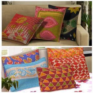 May include: Assortment of colorful kantha throw pillows with various floral and geometric patterns. The pillows are made of cotton and have a quilted design.