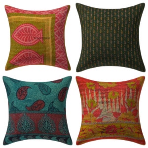 May include: Set of four square throw pillows with different colorful patterns. The pillows are made of kantha fabric, a traditional Indian hand-stitched fabric. The patterns include paisley, floral, and geometric designs.