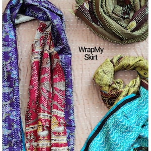 May include: Three colorful silk scarves with intricate patterns and stitching. The scarves are in shades of blue, green, red, and brown. The text "WrapMy Skirt" is visible in the center of the image.