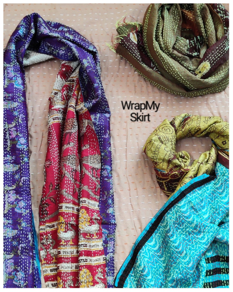 May include: Three colorful silk scarves with intricate patterns and stitching. The scarves are in shades of blue, green, red, and brown. The text "WrapMy Skirt" is visible in the center of the image.