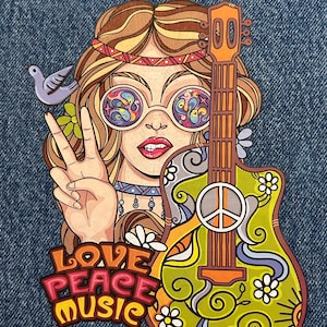 May include: A colorful graphic patch featuring a person with long wavy hair wearing round glasses with swirling patterns, a headband, and a choker. A hand makes a peace sign next to a small bird, and a guitar with a peace symbol and floral motifs is present. The text reads LOVE PEACE MUSIC.
