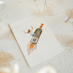 May include: A watercolor illustration of a person riding a wine bottle shaped like a rocket, with the number 40 on the side. The person is wearing a crown and holding a glass of wine.
