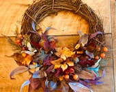 Gorgeous fall wreath with Vibrant fall leaves, persimmons, autumn grass, vine balls, and a grateful sign if you choose, autumn front door