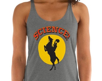 May include: A gray tank top with a yellow circle and a silhouette of a cowboy riding a horse. The text "SCIENCE!" is written in red and black letters around the circle.
