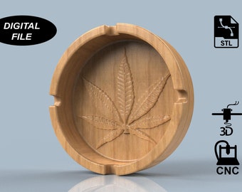 May include: A round wooden ashtray featuring a carved cannabis leaf. The ashtray has three cigarette rests. The words "DIGITAL FILE" are in a black oval. Icons for STL, 3D, and CNC are also present.
