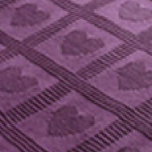May include: A purple knitted blanket with a repeating pattern of leaves. The blanket has a soft, textured surface.