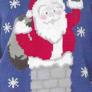 May include: Blue knitted jumper featuring a Santa Claus design. Santa is depicted in a red suit and hat, with a white beard and rosy cheeks, emerging from a chimney. White snowflakes are scattered across the blue background.