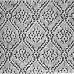 May include: Close-up of a textured, off-white fabric with a repeating diamond pattern. Each diamond is outlined with small dots and contains a floral-like design in the center. The fabric appears to be lace or a similar open weave.