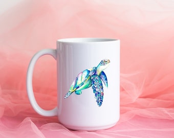 May include: White ceramic mug with a colorful watercolor illustration of a sea turtle. The turtle is swimming with its head up and its flippers outstretched.