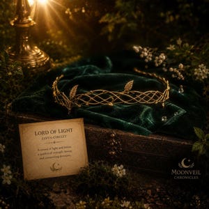 May include: A gold-toned metal circlet featuring an intricate lattice design with delicate leaf accents. A rectangular card is present with the text: LORD OF LIGHT ELVEN CIRCLET. A crown of light and leaves, a symbol of strength, honor, and unwavering devotion.