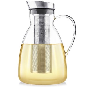 May include: A clear glass pitcher with a stainless steel lid and a built-in strainer. The pitcher is filled with a light yellow liquid.