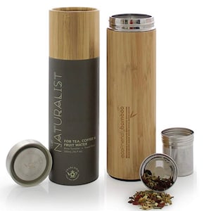 May include: A bamboo travel tumbler with a stainless steel infuser and lid, alongside its cylindrical box. The tumbler is engraved with "ecofriendly bamboo." The box reads "The Naturalist" and "For Tea, Coffee & Fruit Water."