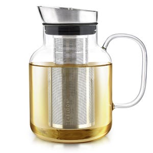 May include: A clear glass teapot with a stainless steel lid and infuser. The teapot is filled with a golden-colored liquid, likely tea. The handle is curved and made of clear glass. The text "TEA BLOOM" is visible on the infuser.