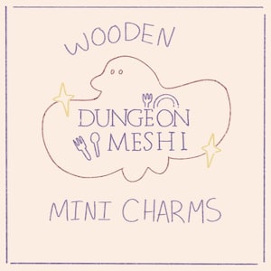 May include: Wooden mini charms with a purple and brown cloud design. The cloud has the text "Dungeon Meshi" inside. The text "Wooden Dungeon Meshi Mini Charms" is below the cloud.