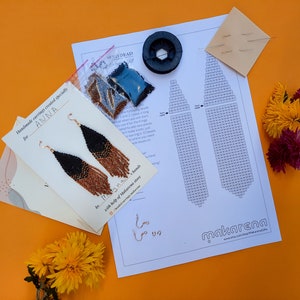 May include: A kit for making beaded earrings with instructions, beads, and thread. The kit is labeled "Handmade earrings created specially for ANNA" and "by ITS A S. hands with help of Makarena store".