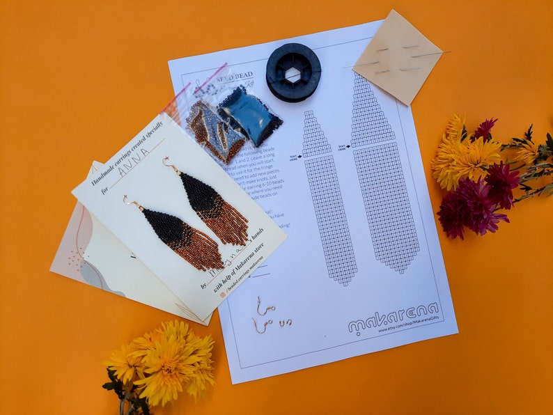 May include: A kit for making beaded earrings with instructions, beads, and thread. The kit is labeled "Handmade earrings created specially for ANNA" and "by ITS A S. hands with help of Makarena store".