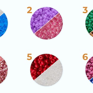 May include: Six different color combinations of round beads, each divided in half. The beads are arranged in a circle, with the colors separated by a line. The colors are: white and blue, purple and pink, green and brown, pink and maroon, red and white, and pink and blue.