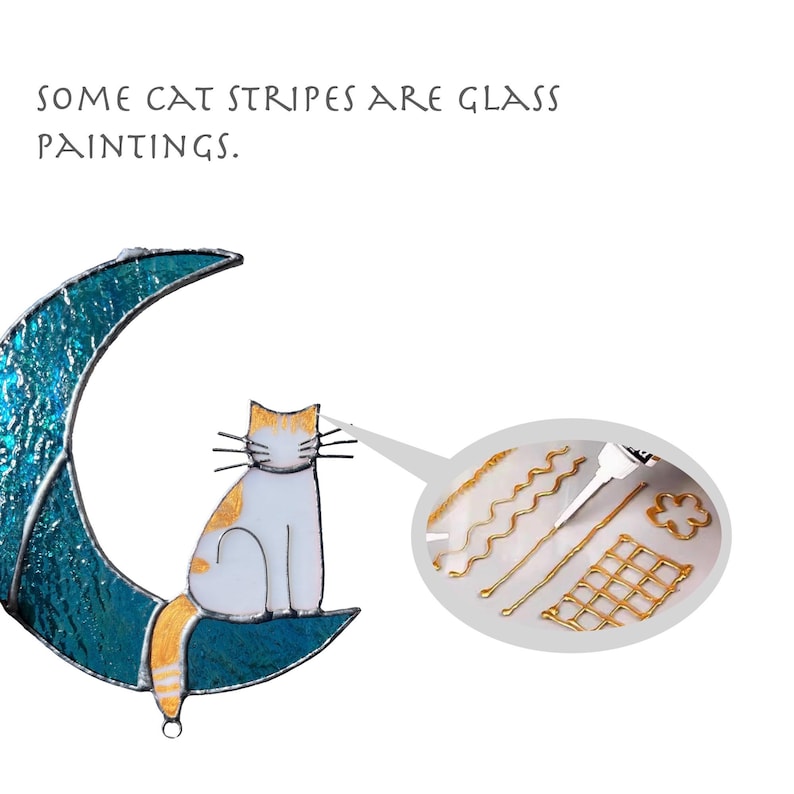 May include: A stained glass moon with a cat sitting on it. The cat is white with orange and brown stripes. The moon is blue and green. The image includes the text "Some cat stripes are glass paintings."