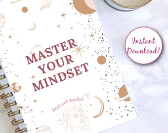 May include: A white spiral-bound notebook with the burgundy text "MASTER YOUR MINDSET". The cover design includes gold celestial illustrations and a woman's face. A sticker with "Instant Download!" is visible.