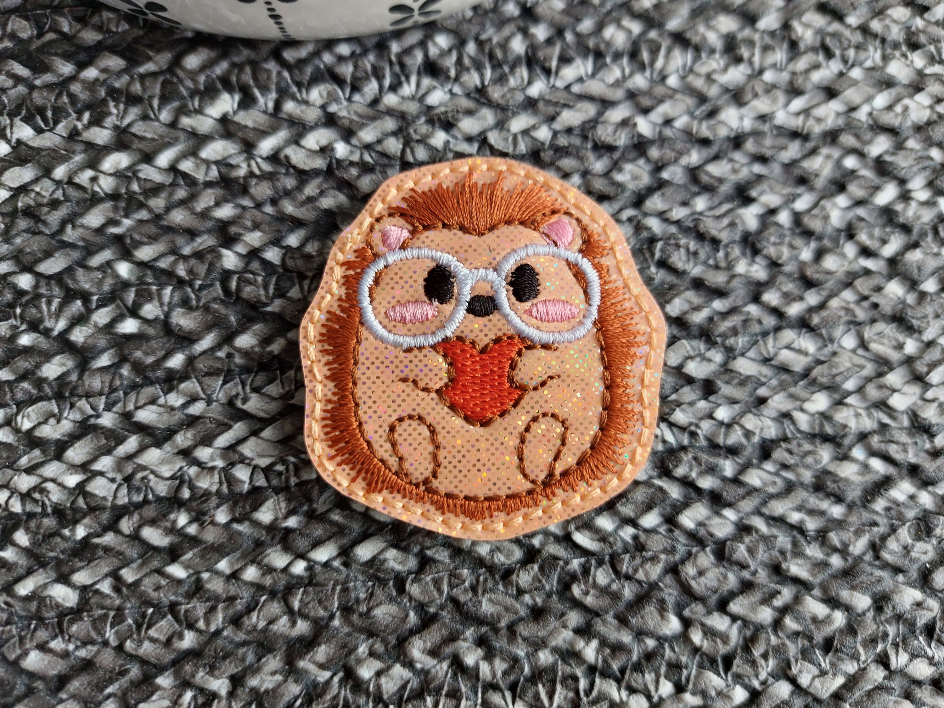 Smart Hedgehog Feltie embroidered on silver vinyl perfect for hair bows, embellishment, badge reels, planner clips, sew on patches and more